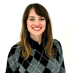 woman with gray sweater and brown hair